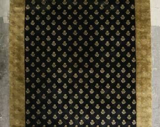 342	Hand Knotted Nepalese Style Rug	"Hand knotted Nepalese style rug. Made in India. Black and brown with leaf motifs throughout. Label on back of rug. Stains, fading and wear throughout rug. Wear and losses to fringe. 

8' 11"" x 11' 10""."
