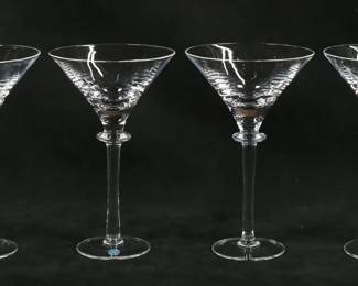 145	4 Steuben Crystal Martini Glasses	4 signed Steuben crystal martini glasses. Each 7 5/8"H. Etched Steuben marks to the undersides,
