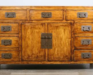 169	Chinese Qing Dynasty Style Sideboard	"Chinese Qing dynasty style sideboard. Elmwood, brass pulls, nine drawers, two doors with brass pin lock. Heavy wear, staining, marks and gouges to top of sideboard. Small chips and wear to edges of sideboard. 

62 1/4"" W x 21 3/4"" D x 35 3/4"" H. Base is 179 lbs"
