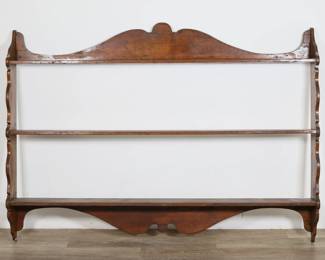 97	Rustic Farmhouse Hanging Wall Curio Shelf	"Rustic farmhouse hanging wall curio shelf. 19th century. Carved wood in three tiers. Ring stains, scratches and wear throughout wood of tiers. Gouges to wood on left side. Crack and repair to wood on top right corner of shelf. Pilot holes to wood on back. Cracks and repairs to left and right sides of bottom tier. 

74"" W x 7 3/8"" D x 53 5/8"" H. 33 lbs."
