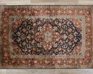 349	Persian Style Rug	"Persian style rug. Floral motifs and medallion against red and blue field. Staining and smoke damage to rug. Tattering, stains and wear to fringed edges. Slight creasing throughout. 

3' 11 5/8"" x 6' 1"". 12 lbs."
