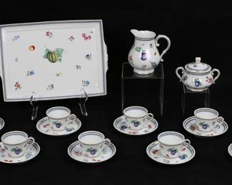 317	19 Piece Richard Ginori Italian Fruits Demitasse	19 piece Richard Ginori Italian porcelain demitasse set in the Italian Fruits pattern. 8 cups, 8 saucers, tray, creamer and lidded sugar bowl. Cups and saucers in original boxes. Tray 13 1/4"L, saucers 5"-diameter. Wear, tears and losses to boxes.
