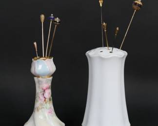 240	8 Hatpins Including 14k Gold Tiffany	Lot of 8 vintage hat pins. Signed Tiffany & Co. 14k gold hatpin, 4.5 grams including stones; one marked 9 CI, 1.2 grams; 2 unmarked gold hatpins acid tested 10k, total 3.5 grams; 14k with gold filled pin, 3.1 grams total; 14k acid tested, 3.2 grams total; one marked filled pin; one acid tested 14k with pearl, purple stone and gold tone pin, 6.9 grams total. In two porcelain hatpin holders, RS Germany and Limoges. Tiffany pin 6 3/8"L.
