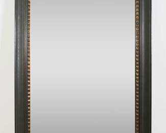 285	Restoration Hardware Style Contemporary Mirror	"Restoration Hardware style contemporary mirror. Beveled mirrored surface with black and gilded frame. Framed by Wade Maxx Art Gallery and Framing, NY. Wade Maxx label on back of mirror. Wear throughout mirrored surface. White blemishes and marks to bottom and right lower edge of frame. Scratches to wood on right side of frame. Scuffs and wear throughout frame. Tears to paper backing. 

56"" x 30"". 35 lbs."
