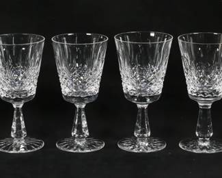 151	8 Waterford Crystal Kenmare Water Goblets	8 pieces signed Waterford crystal stemware. Water goblets in the Kenmare pattern. All with etched Waterford marks. Each 6 7/8"H. Two with rim chips, one chipped and cracked on the rim.
