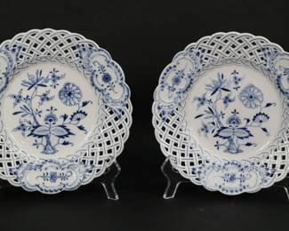 311	Pair of Meissen Blue Onion Porcelain Plates	Pair of Meissen porcelain salad plates, in the Blue Onion pattern. Pierced rims. Both with blue crossed swords marks. Each 8 1/4"-diameter.
