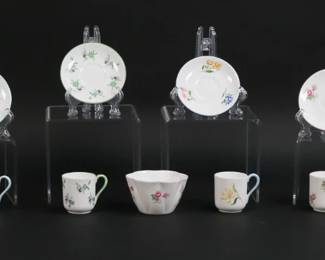 314	8 Shelley Miniature Porcelain Cups & Saucers	8 Shelley miniature English bone china cups and saucers. Six 1 5/8"H cups with 2 7/8"-diameter saucers, two 1 1/8"H cups with 2 3/8"-diameter saucers. With a Shelley bone china sugar bowl, 1 1/2"H x 2 5/8"-diameter.
