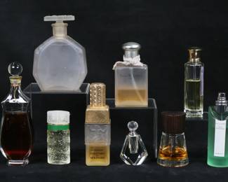 437	Lot of Designer Perfume Including French, Burberry	Lot of designer perfume. Yves Delorme 100ml partially full, Bulgari Au the vert 75 ml mostly full, Molinard de Molinard 3 1/3 fl. oz. partially full, Lancome O de Lancome 28ml full, Burberry Touch 50ml partially full, Verte Violette 1.7 fl oz half full, Jean Desprez Bal a Versailles mostly full. With a crystal perfume bottle and a Lalique style frosted glass perfume bottle. Bal a Versailles missing labels, Lancome label torn, frosted glass bottle stopper frozen.
