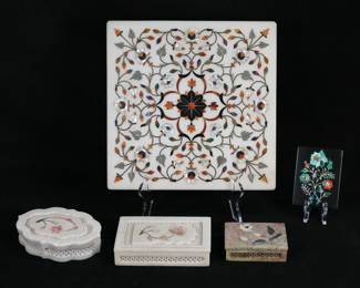 374	5 Piece Pietra Dura Lot	5 inlaid pietra dura decorative items. All hardstone with inlaid floral motifs. Paperweight, 3 boxes, tile. Tile 11 5/8" x 11 1/2". Chips to corners of tile, scratches and minor chips to edges of boxes and lids, large chip to the rim of one box, smallest box losses to inlay on lid.
