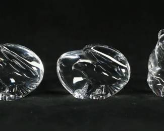 143	5 Steuben Crystal Hand Coolers	Lot of 5 signed Steuben crystal hand coolers. Turtle, bear, frog, 2 eagles. Eagle 2 3/4"L x 2"H. All signed Steuben on the undersides. Turtle, bear and one eagle with original boxes. Some wear and fraying to boxes.
