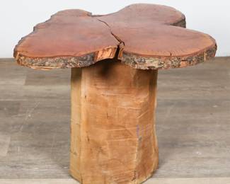 160	Rustic Live Edge Tree Trunk End Table	"Rustic live edge tree trunk end table. Cut slice of tree trunk poly-coated and treated set upon unfinished tree stump base. Cracks and split to wood on top. Scratches and wear to wood on center of top. Small losses to bark along edge of top. Writing on side and top of trunk base. Top is not attached.

27 1/2"" W x 24 3/4"" D x 20 1/2"" H. 55 lbs."
