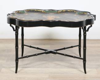 299	Chinoiserie Style Butler's Tray Table	"Chinoiserie style butler's tray table. 20th century. Removable tole tray with painted federal eagle, arrows and shield sitting atop a Regency style bamboo-form lacquered base. Small chips, losses and scuffs to lacquer on edges of table top. Large scratch to paint on tray top. Nicks, scuffs and wear to wood on legs, feet, and stretcher. 

34 1/2"" W x 26 1/8"" D x 20 5/8"" H. 20 lbs."
