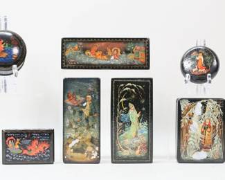 39	Lot of Palekh Boxes	Lot of 9 Russian Palekh lacquer boxes. All signed in Cyrillic. Most with fairytale scenes. Rectangular box with horses 6 5/8"L x 2 3/8"D x 1 1/4"H. All as is, with crazing, chips to edges and corners, most with chips and losses to lacquer.
