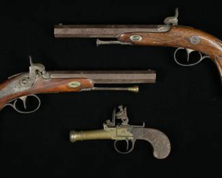 84	Flintlock Pistol & Pair of Dueling Pistols	Box-Lock flintlock pocket pistol, 6 1/2"L; near pair of dueling pistols, each 12 1/2"L. All appear unmarked. Wear to wood handles on all, split and loss to wood and split to wood on one dueling pistol, scratch to wood and screw missing from one dueling pistol, dueling pistols plugged, dueling pistols with wear and rusting to barrels, flintlock wear to barrel.
