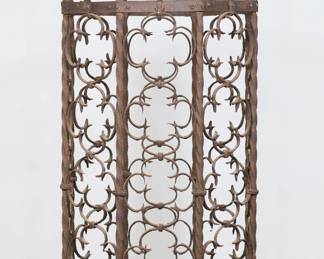 208	Cast Iron Decorative Octagonal Bird Cage	"Cast iron decorative octagonal bird cage with hanging hook. Original bottom lid is missing. Three bottom pins are bent and misaligned. Rusting, corrosion, and wear throughout bird cage. 

20 3/4"" W x 20 1/8"" D x 51 1/2"" H. 67 lbs."
