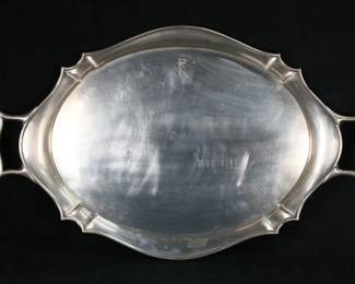 256	Roberts & Belk English Sterling Serving Tray	Hallmarked English sterling silver two handled serving tray. Roberts & Belk Ltd., London, circa 1906. 26"L including handles, 2940 grams. Adhesive residue to front of tray.
