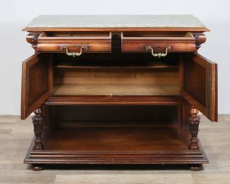 211	French Renaissance Revival Marble Top Sideboard	"French Renaissance Revival marble top sideboard or buffet. Late 19th century. White and green marble top, two drawers, one shelf, heavily carved lion and acanthus forms. One key is included. Chips and losses to marble on front right corner and front and back edges. Repairs and remnants of glue to marble. Two small cracks to back paneling. Scratches, marks, wear, and ring stains to wood on lower tier. Chips and scuffs to wood throughout bottom molding. Escutcheon missing from right drawer. One decorative leaf-form end on right drawer pull is missing.

51 1/4"" W x 20 3/8"" x 39 1/2"" H. 171 lbs."
