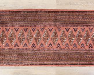 401	Bokhara Style Runner Rug	"Bokhara style runner rug. Repeating medallions against muted red field. Wear, fading and pilling throughout. Losses, scorch marks, and tattering to fringed edges.  Fraying to edges. 

2' 5"" x 9' 11 1/2"". 12 lbs."
