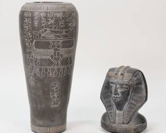 187	Egyptian Canopic Jar	Stone carved reproduction Egyptian canopic jar. 16 1/8"H. Minor chips along the rim and base.
