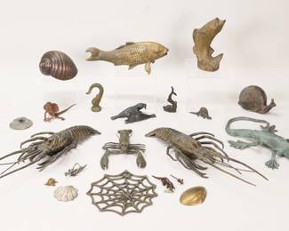 426	Lot of Metal Animals	Lot of metal animals. Including snail, shells, spider web, grasshopper, grasshopper, turtle, frog, fish, walrus, lobsters including pair, lizard. Largest fish 10"L, lizard 11 3/4"L, lobster pair each 16"L. All with some wear and losses to patina.
