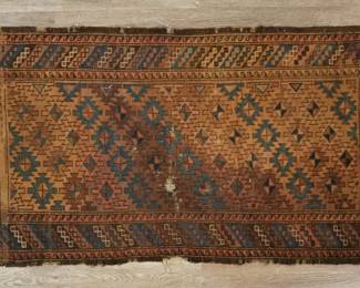 404	Caucasian Style Rug	"Caucasian style rug. Geometric medallions against yellow field and fringed edges As is, with heavy wear, losses to fringe, tattering, tears, staining and fading throughout. 

2' 6"" x 4' 10 1/4"". 4 lbs."
