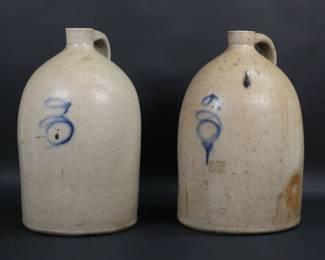 71	Pair of Blue Decorated 3 Gallon Stoneware Jugs	Pair of 3 gallon stoneware jugs. Each with blue painted 3. Each 15 1/2"H x 9 1/8"-diameter. One with cork. Line through body and chip to base of one.
