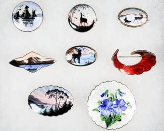 247	8 Norwegian Sterling & Enamel Brooches	Collection of Norwegian sterling silver and enamel brooches. All marked 925 with various maker's marks. Sailboats and boat in mountain landscape both Nils Erik Elvik, lake landscape with trees OF Hjortdahl, deer in landscape Clement Berg, deer in mountain landscape Gustav Hellstrom, reindeer pulling sleigh Hans Myhre, flowers and red enamel both Ivar T. Holth. Hjortdahl lake landscape brooch 1 5/8"L. 55 grams total.
