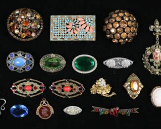 248	Lot of Vintage Pins & Brooches	Lot of vintage costume jewelry pins and brooches, including signed Wagner, gold tone, silver tone, cameo. With two pendants. Largest rectangular brooch 2 3/8" x 1 3/8". Rectangular brooch missing turquoise enamel, pin repaired on organizational pin.
