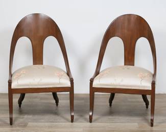 164	Pair of Regency Style Spoonback Chairs	"Pair of Regency style spoonback chairs. Mahogany and floral upholstery. Scratches, marks, and scuffs to wood on arms and backs of both chairs. Nicks to edges of legs on both chairs. Wear, fading, fraying, pilling, and light staining to upholstery on both chairs.

21 3/8"" W x 24 5/8"" D x 35 5/8"" H. 40 lbs total."
