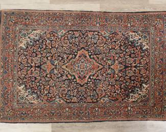 408	Persian Style Rug	"Persian style rug. Floral motifs against red and blue field. Losses and wear to fringe. Fading, wear and pilling throughout. Slight warping throughout rug. 

3' 6"" x 5' 4"". 11 lbs."
