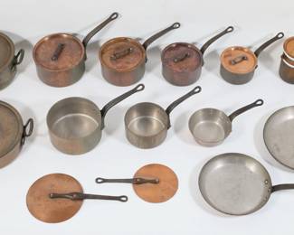 332	12 Pieces E. Dehillerin French Copper Cookware	12 pieces E. Dehillerin French copper cookware. 2 skillets, saucepans and pots in various sizes double boiler with porcelain insert. All except skillets and one small pot with lids. Largest pot 4 7/8"H x 9 1/2"-diameter, 3.18mm thick. All marked Villedieu France or Made in France and all but double boiler marked E. Dehillerin Paris. All with wear, losses to copper patina, scratches and wear to linings and exteriors.
