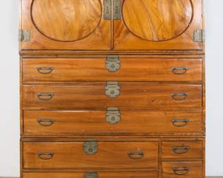 167	Chinese Campaign Chest	"Chinese campaign chest. 20th century. Three pieces, two doors,  five drawers with cylindrical slide locks, three small drawers. Crack and split to right door on upper chest. Cracks to wood on bottom panels of all drawers except smallest three. Wear and scratches throughout wood on both chests. Brass on lock of upper drawer is loose and missing one pin. Left handle on top chest is recessed and cannot slide out. Handles on lower chest are recessed and are difficult to remove and slide. Chips and losses to wood on front right edges of bottom chest. Wear to interior of upper chest. Major separations to bottom paneling of drawers. Scuffs and marks to front of bottom chest. Chips and losses to wood on back corners of bottom chest. Chips and marks to wood on left and right sides of bottom chest. Repairs to wood on front corners of bottom chest.

48"" W x 16 3/4"" D x 62 1/4"" H. 170 lbs.
"
