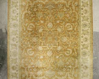 339	Persian Rug	"Persian rug. Gold and cream colors with floral motifs throughout. Minor losses to fringe on both sides of rug. 

12' 1"" x 8' 11""."
