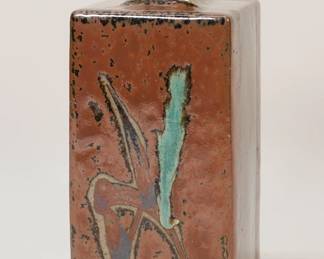 322	Attributed to Shoji Hamada Pottery Bottle	Attributed to Shoji Hamada (Japan, 1894-1978). Japanese stoneware square pottery bottle. Unsigned, no box. 7 7/8"H.
