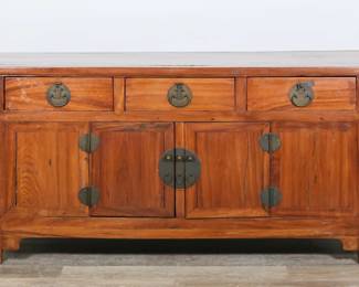 171	Chinese Altar Form Sideboard	"Chinese altar form sideboard. Three drawers, two doors, carved floral fretwork. Cracking, wear and scratches to wood. Cracks to wood throughout doors and front panels. Small chip to wood on fretwork on left side. Warping to wood on left fretwork. Scuffs and marks to apron on front. Right door and frame is slightly warped and loose. Cracks and splits to wood on left and right sides. Chip to wood on top molding on right side. Scratches and wear to interior. Chips and losses to wood on top front edge and edges around drawers. 

86 1/8"" W x 21"" D x 34 1/4"" H. 119 lbs."
