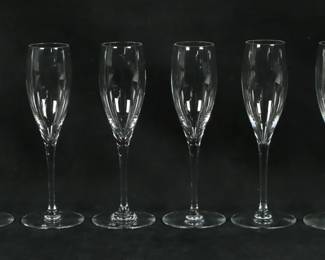 147	8 Baccarat Crystal St. Remy Champagne Flutes	8 pieces Baccarat crystal stemware. Fluted champagnes in the St. Remy pattern. All with etched Baccarat France marks to the undersides. Each 8 5/8"H.
