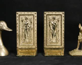 29	3 Pair of Brass Bookends	3 pair brass bookends. Pair of Virginia Metalcrafters Inc. The Doors to the Library of Congress bookends, Intellectus and Humanitas, each 7 3/4"H; pair of unsigned dog bookends, each 5 5/8"H; pair of Rosenthal Netter duck bookends, partial paper labels, each 6 1/4"H. All with scratches and wear to brass patina.

