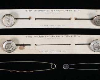 243	2 Sets of Norene Safety Hat Pins & 2 Touring Pins	2 carded sets of English steel Norene safety hat pins, one with winter sleigh scenes, one with portraits of a woman; with two "touring" safety pin / hatpins, 1 sterling. Norene pins each 11 5/8"L. Discoloration and warping to cards, losses to finish and wear to both sets of Norene pins.
