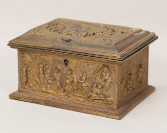 423	AB Paris Gilt Bronze Dresser Box	Gilt bronze dresser box / jewel casket. Lid and four side panels each with genre scenes in relief. Signed on the underside AB Paris. 6 1/4"W x 5"D x 3 1/2"H. Feet missing, dents to lid and latch missing from lid, losses to patina throughout, tears and discoloration to lining.

