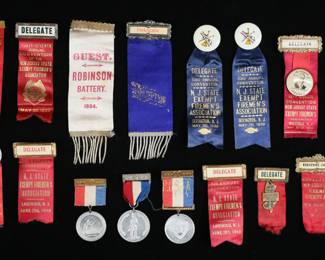 384	Lot of Organizational Firemen's Ribbons & Pins	Lot of organization ribbons and pins, mostly New Jersey firemen's convention. Including 1911 president's ribbon, 1920s-1940 ribbons, 1884 Robinson Battery ribbon, 1891 medal. Robinson Battery ribbon 6 1/2"L including fringe. All with wear, fraying, minor tears, losses to lettering.

