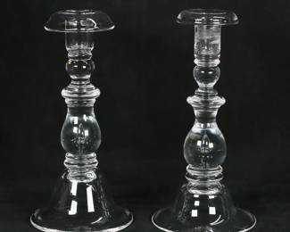 140	Near Pair of Steuben Teardrop Crystal Candlesticks	Near pair of Steuben glass candlesticks, control bubble "teardrop" in the stems. Both signed Steuben on the bases. Each 9"H.
