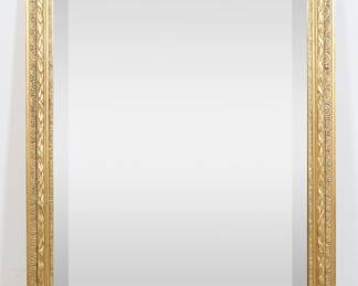 290	Friedman Brothers Neoclassical Style Mirror	"Neoclassical style mirror by Friedman Brothers. American, 21st century. Gilded acanthus-form frame and beveled mirror. Friedman Brothers label on back of mirror. Large chip and loss to wood on top edge of frame. Chips and losses to wood and gilding on corner and edges of frame. 

48 1/4"" x 36 1/4"". 38 lbs."
