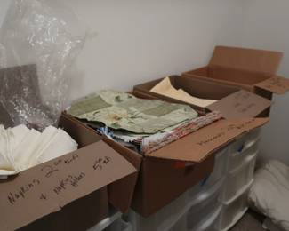 tablecloths, place mats, napkins, plastic storage  containers