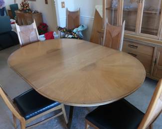 This  is  a  view  with  the  two  leaves of  the    B F  Huntley  table. The  finish  is  burnished  chestnut.  The  name  is   I  Dream  of  Jeannie. There  are    three   12"  leaves. 