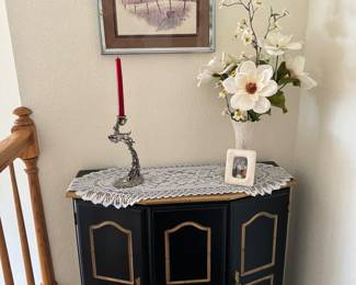 I’m just a little black table with lovely gold lines and I have two - two doors in one!! 