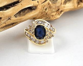 Lot #SB 314 - Beautiful Sapphire and Diamond Ring in a 14k Gold Ring (Size 7.5) 1.08 Carat Dark Oval Cut Sapphire 