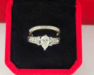 Lot #SB 311 - Engagement Ring 14k White Gold w/ 1.10 Carat Pear Shaped Diamond Center Stone and 26 Smaller Diamonds.  Plus 10k Diamond wedding band