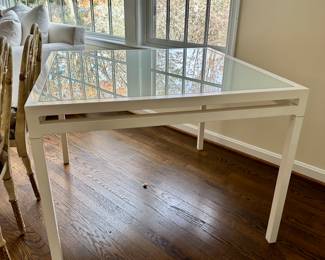 40 " L x 40" W. One leg is loose. 