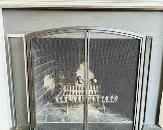 Folding fireplace screen with doors.