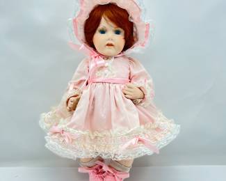 Sweet Little Girl 16” Porcelain Doll. She is jointed has auburn hair and bright blue eyes